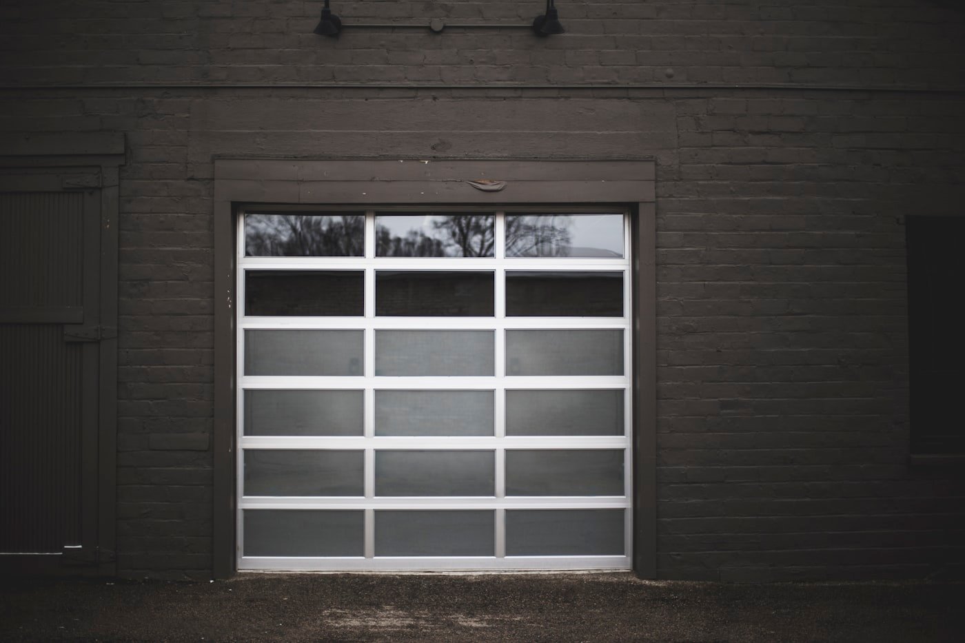 Modern full-view glass and aluminum garage door